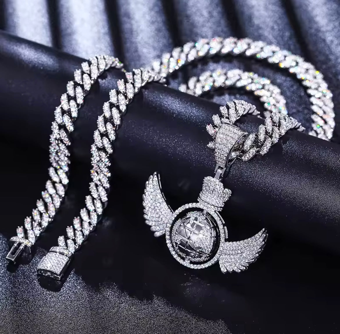 Rotating Global Wing Pendant
